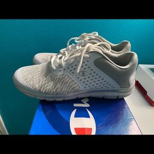 Champion white shoes.